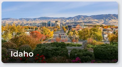 Idaho city skyline with autumn trees and mountain landscape, scenic urban view