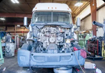 Semi truck engine repair with hood open